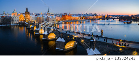 High Resolution Panorama Picture of Winter Snowy Prague Old Town with Prague Castle and Charles Bridge above River Vltava during Sunset , Czech republic High Resolution Panorama Picture of Winter Snowy Prague Old Town with Prague Castle and Charles Bridge above River Vltava during Sunset , Czech republic 135324243