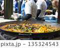 Traditional Spanish Seafood Paella at a Busy Street Food Market 135324543