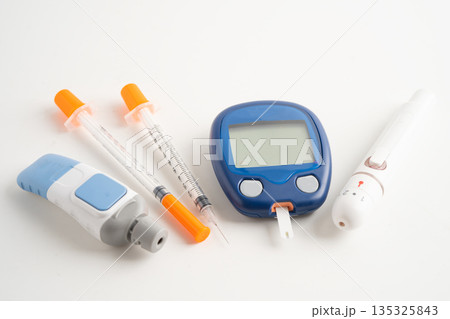Glucometer lancet and test stick measuring human blood sugar level for diabetes. 135325843