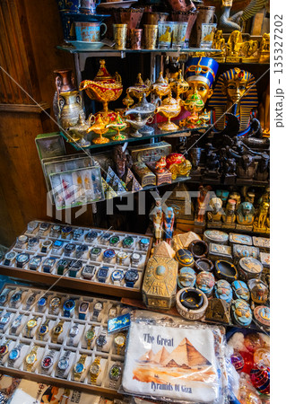Khan el-Khalili market in Cairo features vibrant stalls filled with colorful goods. Diverse people browse the market, surrounded by traditional architecture and lively atmosphere. 135327202