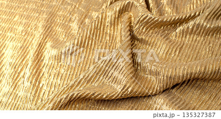 A close-up shot of gold sequin fabric A close-up shot of gold sequin fabric 135327387