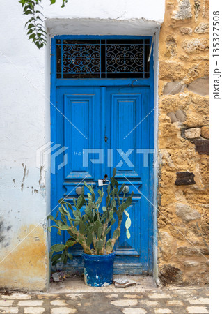 Traditional blue gate in Bizerte medina, Tunisia 135327508
