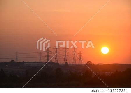 high voltage electric pole on twilight sunset sky in evening high voltage electric pole on twilight sunset sky in evening 135327824