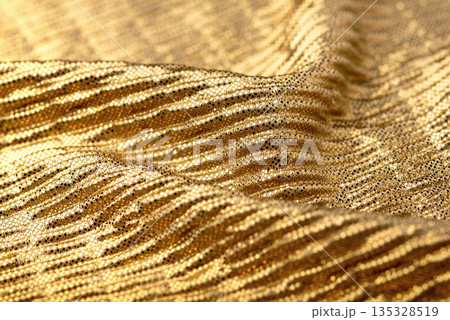 A close-up shot of gold sequin fabric A close-up shot of gold sequin fabric 135328519
