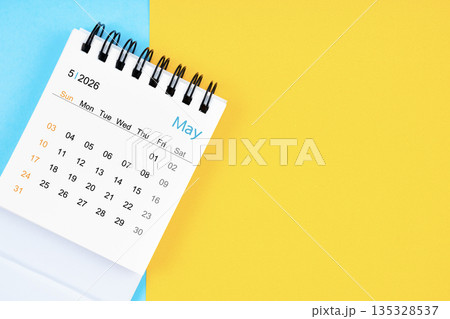 May 2026, Monthly desk calendar for 2026 year on yellow and blue background. 135328537