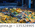 Traditional Spanish Seafood Paella Cooking in Large Pan 135328905