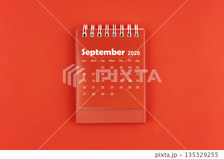 September 2026 red color desk calendar on red  background. 135329255