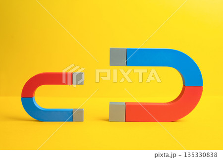 The confrontation between big and small magnets. The concept of competition for recruits and investments. Talent attraction battle, capital flow rivalry 135330838