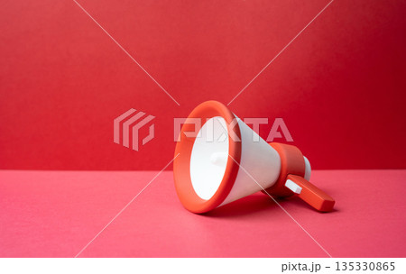 Megaphone on a red background. Marketing and advertising. Propaganda and broadcasting. High impact communication, urgency messaging and attention grabbing campaigns influencing public opinion Megaphone on a red background. Marketing and advertising. Propaganda and broadcasting. High impact communication, urgency messaging and attention grabbing campaigns influencing public opinion 135330865
