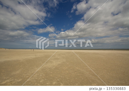 A gust of wind blowing over the beach A gust of wind blowing over the beach 135330883