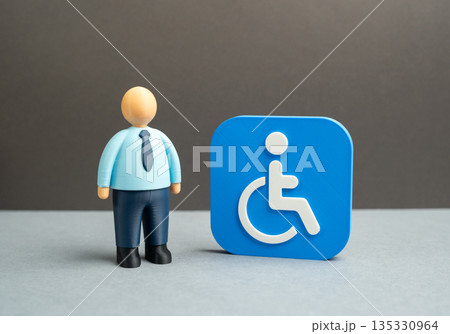 An office worker and a symbol of disability. Workplaces and support for people with disabilities. Inclusive employment, reasonable accommodations and equal opportunity policies in modern organizations 135330964