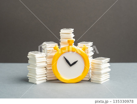 Stacks of papers and a stopwatch. Paperwork and bureaucratic burden on businesses. Reporting deadlines. Administrative overload, time pressure and compliance costs reducing productivity 135330978