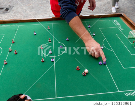 People playing Subbuteo 135333961