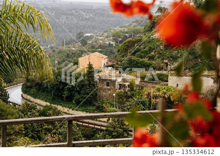 Hilltop City Of Ragusa In Sicily Under Overcast Sky: Historic Stone Buildings And Dense Urban Landscape In Soft Diffused Light And Hazy Weather 135334612