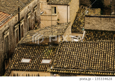 Panoramic View Over Ragusa From Cathedral Of San Giovanni Battista: Historic Sicilian City Rooftops, Church Domes, And Dense Stone Architecture Under Overcast Sky Panoramic View Over Ragusa From Cathedral Of San Giovanni Battista: Historic Sicilian City Rooftops, Church Domes, And Dense Stone Architecture Under Overcast Sky 135334628