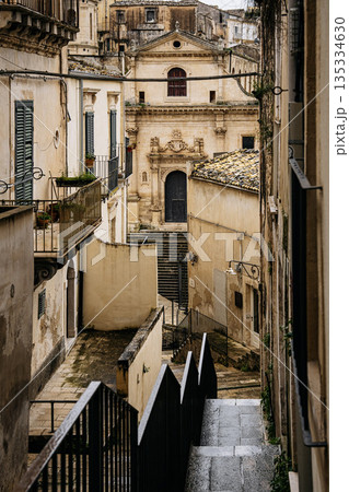 Church Of Santa Maria Dell Itria In Ragusa, Sicily: Historic Baroque Stone Facade And Bell Tower Rising Above Traditional Southern Italian Old Town Church Of Santa Maria Dell Itria In Ragusa, Sicily: Historic Baroque Stone Facade And Bell Tower Rising Above Traditional Southern Italian Old Town 135334630