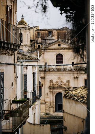Church Of Santa Maria Dell Itria In Ragusa, Sicily: Historic Baroque Stone Facade And Bell Tower Rising Above Traditional Southern Italian Old Town Church Of Santa Maria Dell Itria In Ragusa, Sicily: Historic Baroque Stone Facade And Bell Tower Rising Above Traditional Southern Italian Old Town 135334652