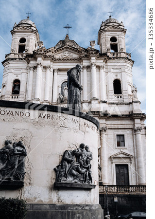Church Of San Camillo Ai Crociferi In Catania, Sicily: Historic Baroque Church Facade With Twin Bell Towers And Stone Architecture Under Cloudy Sky 135334686