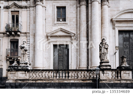 Church Of San Camillo Ai Crociferi In Catania, Sicily: Historic Baroque Church Facade With Twin Bell Towers And Stone Architecture Under Cloudy Sky Church Of San Camillo Ai Crociferi In Catania, Sicily: Historic Baroque Church Facade With Twin Bell Towers And Stone Architecture Under Cloudy Sky 135334689