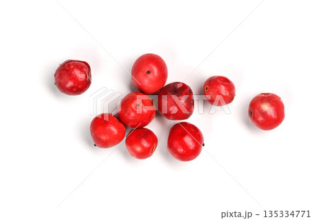 Red or pink peppercorns on board, closeup photo isolated with white background Red or pink peppercorns on board, closeup photo isolated with white background 135334771