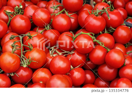 Fresh ripe red tomatoes on display on street food market, closeup detail 135334776