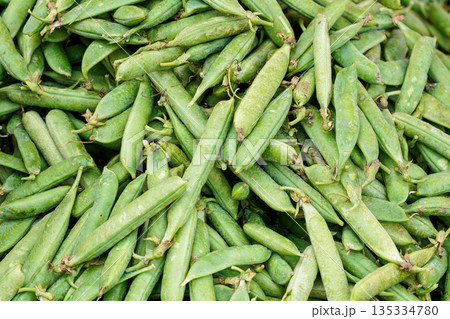 Pile of fresh green peas displayed on street food market 135334780