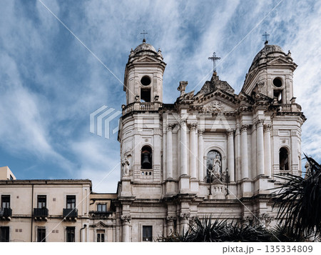 Church Of San Camillo Ai Crociferi In Catania, Sicily: Historic Baroque Church Facade With Twin Bell Towers And Stone Architecture Under Cloudy Sky 135334809