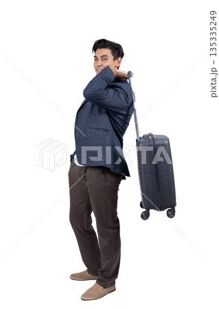 Traveler standing with luggage looking away 135335249