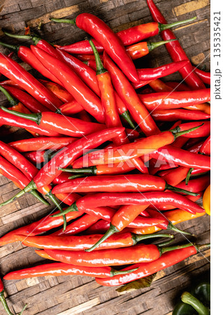 Background and texture of hot red Chinda Chili, Type of Thai chili pepper Background and texture of hot red Chinda Chili, Type of Thai chili pepper 135335421