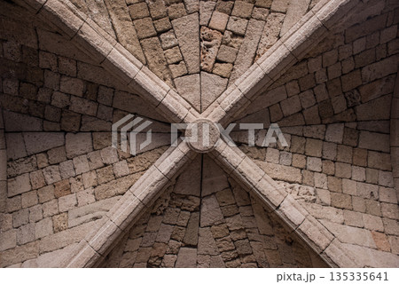 Antique ceiling with rose window and cross beams 135335641