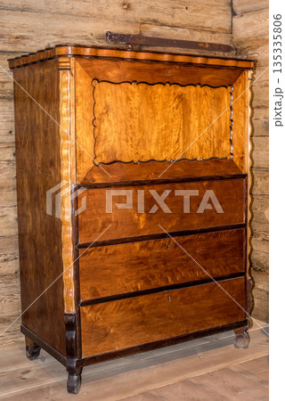 The tall chest of drawers in the background of an old house The tall chest of drawers in the background of an old house 135335806