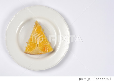 Orange Cake Slice on White Plate Orange Cake Slice on White Plate 135336201