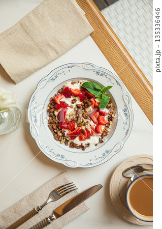 Granola bowl with yogurt and fresh strawberries 135336446