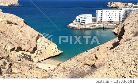 Hidden Coastal Paradise, Unexplored Bay With Vibrant Waters, Beautiful Cove Surrounded By Towering Cliffs And Clear Waters, Secluded Ocean Retreat With Striking Geological Features And Azure Seas 135336581