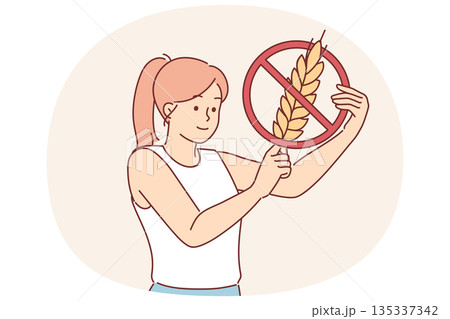 Woman holds gluten-free sign, urging people to stop eating foods containing grains and wheat Woman holds gluten-free sign, urging people to stop eating foods containing grains and wheat 135337342