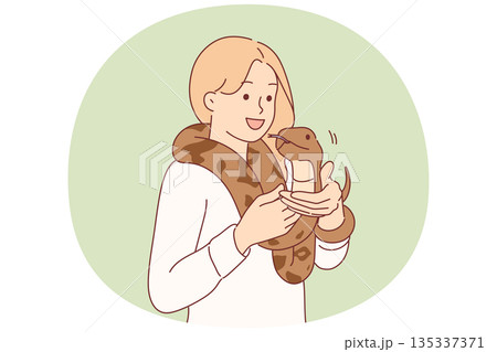 Woman with long snake around neck poses for photo with dangerous reptile predator 135337371