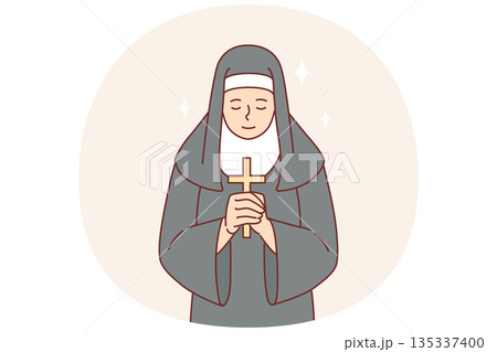 Nun praying holding catholic cross in hands and bowing to god, dressed in cassock Nun praying holding catholic cross in hands and bowing to god, dressed in cassock 135337400
