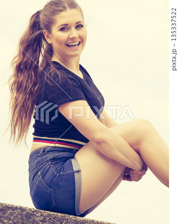 Happy teenager woman outside. Happy teenager woman outside. 135337522