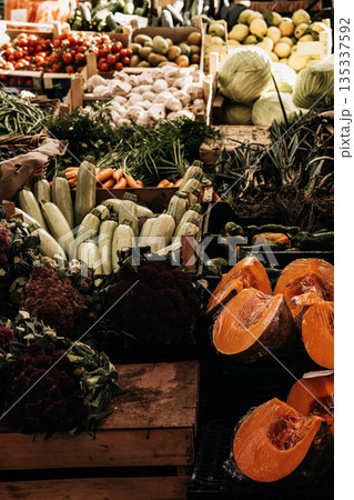 Fresh Seasonal Vegetables At Traditional Market Stall: Artichokes, Beans, Cabbage, Zuccini, Potatoes, And Root Vegetables Displayed In Abundant Mediterranean Food Market Scene Fresh Seasonal Vegetables At Traditional Market Stall: Artichokes, Beans, Cabbage, Zuccini, Potatoes, And Root Vegetables Displayed In Abundant Mediterranean Food Market Scene 135337592