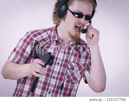 Gamer man shooting from gun 135337790
