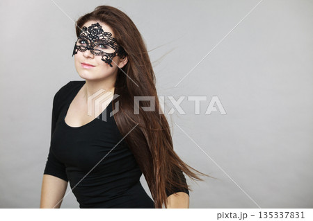 Mysterious woman wearing lace mask Mysterious woman wearing lace mask 135337831