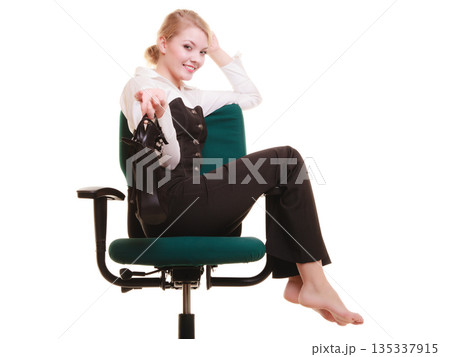 Break from work. Businesswoman relaxing on chair. Break from work. Businesswoman relaxing on chair. 135337915