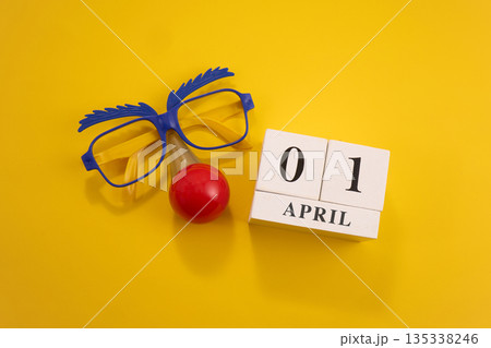 Celebrating april fool's day with funny glasses and clown nose 135338246