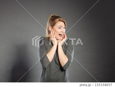 Scared frightened young female. 135338657