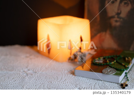 A devotion book and a rosary symbolizing deep Christian faith, spirituality and faith during Lent A devotion book and a rosary symbolizing deep Christian faith, spirituality and faith during Lent 135340179