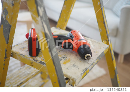 Tools on a ladder during a home repair project Tools on a ladder during a home repair project 135340821