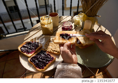 Sunny Balcony Breakfast With Peanut Butter And Jelly Toasts On A Round Table Sunny Balcony Breakfast With Peanut Butter And Jelly Toasts On A Round Table 135341077