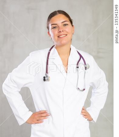 Young woman posing in medical uniform in studio Young woman posing in medical uniform in studio 135341349