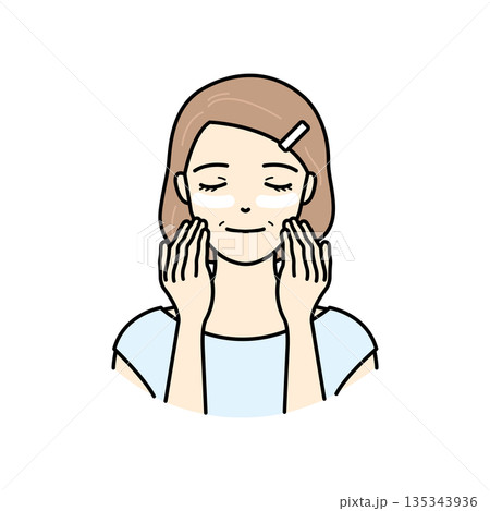 目元にアイクリームを塗りエイジングケアをするシニア女性 目元にアイクリームを塗りエイジングケアをするシニア女性 135343936