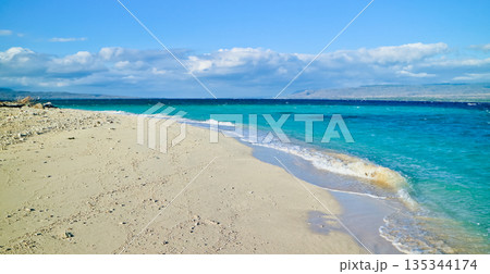 Beautiful view of white sand beach and blue sky 135344174